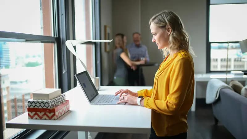 Lettings negotiator working at a standing desk