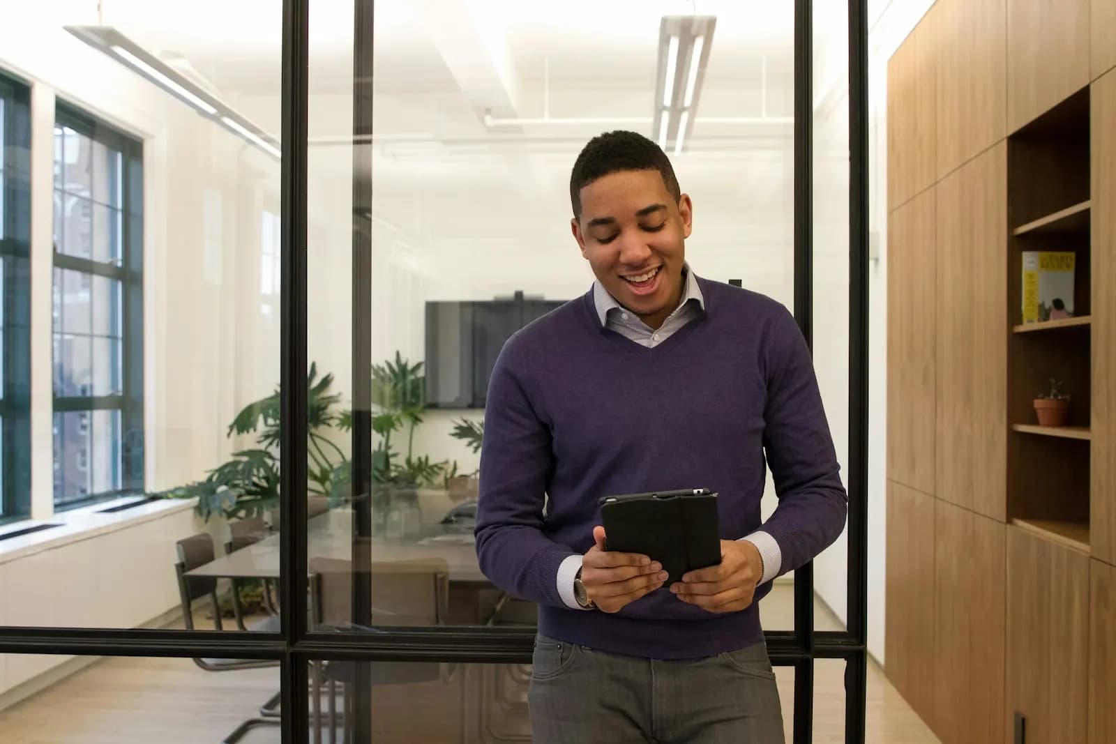 Property manager checking a tablet in the office