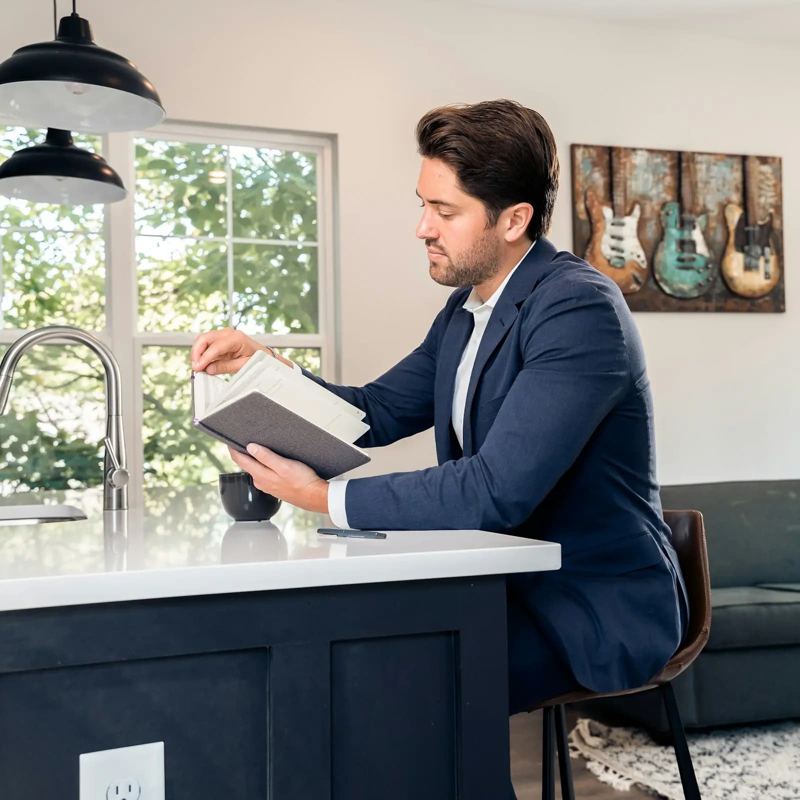 Landlord reviewing documents at a kitchen counter