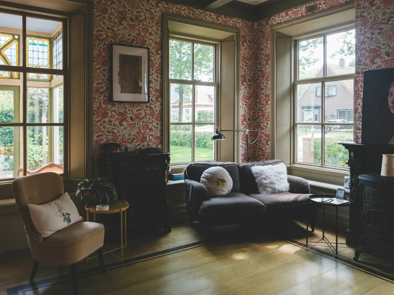 A bright living room with bay windows in a period home